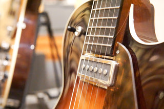Close-up of a guitar with a blurred background