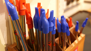 Tin whistles with red and blue mouthpieces