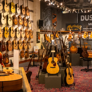 Cozy room with warm carpet and dozens of guitars