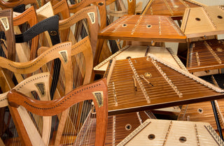 Large group of Dusty Strings lever harps and hammered dulcimers