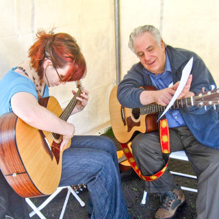 Guitar student and teacher in a lesson